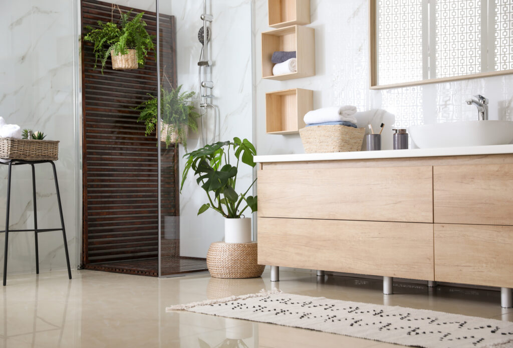 Bathroom interior with shower stall and houseplants. Idea for de